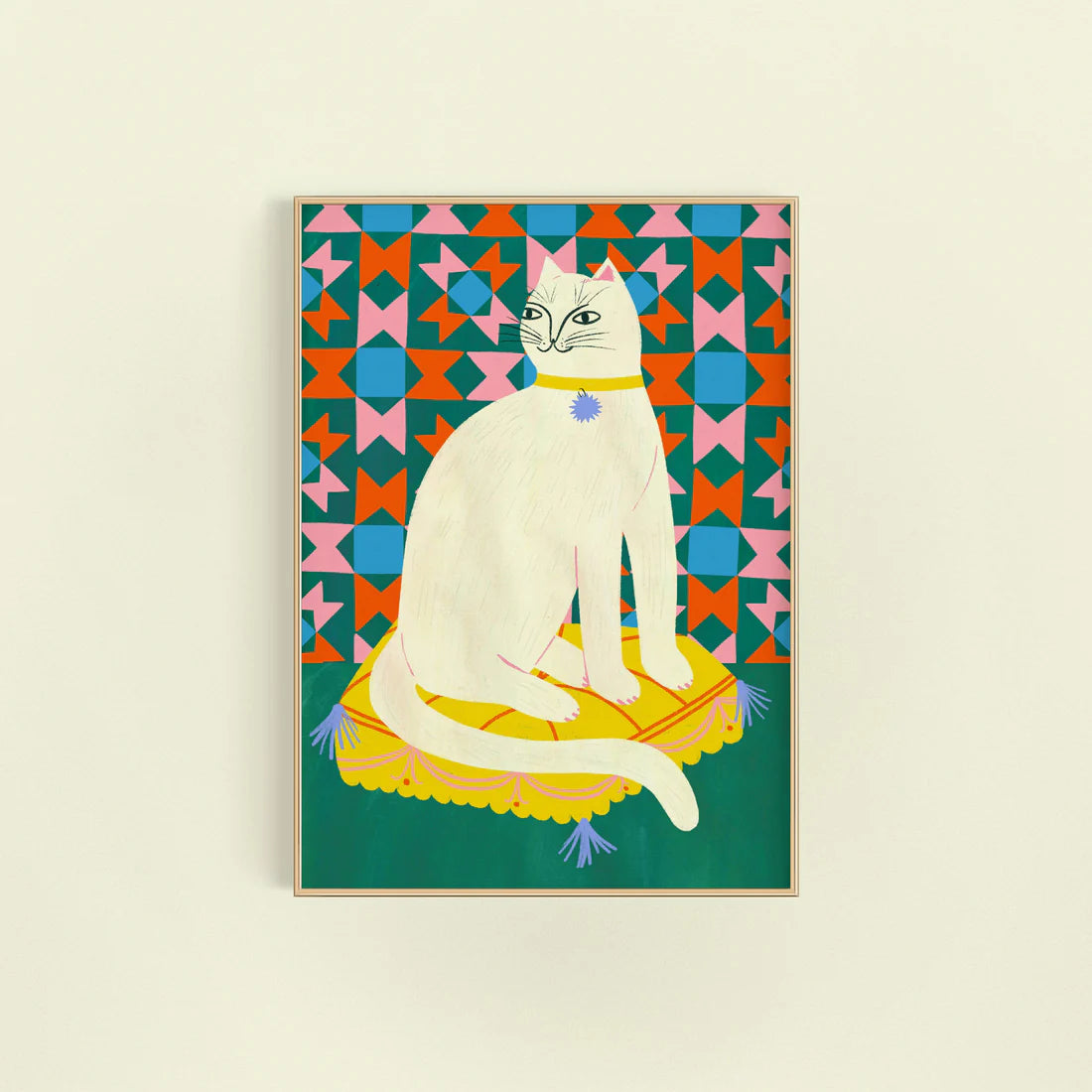 An art print featuring a stylized white cat sitting on a yellow cushion against a colorful geometric patterned background.