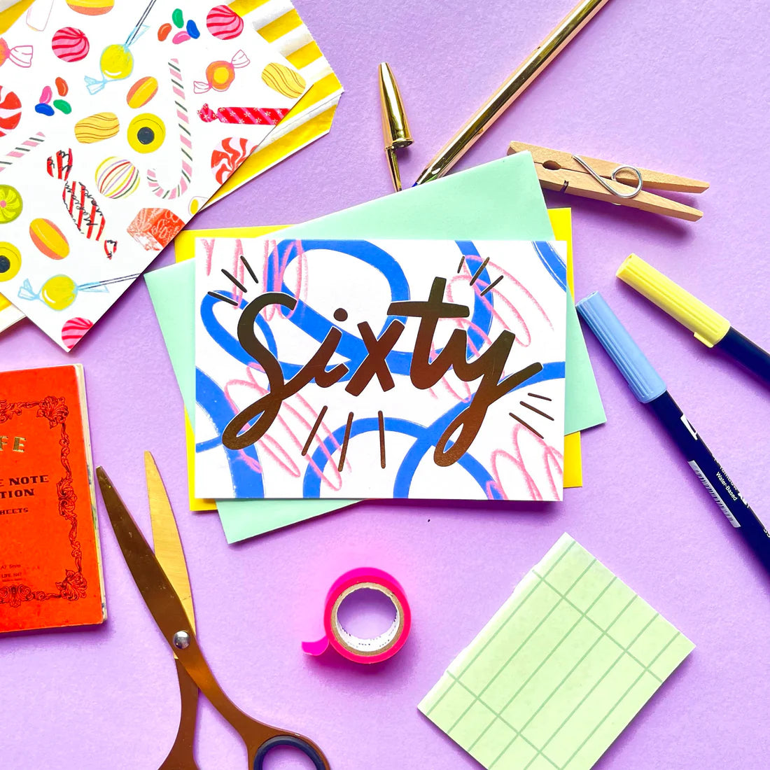 A6 card with "sixty" text and a pink envelope