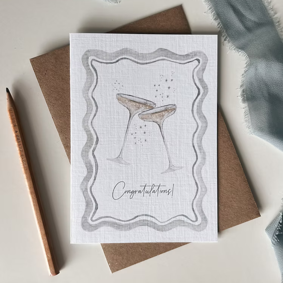 Greeting card with two champagne glasses and 'Congratulations!' text
