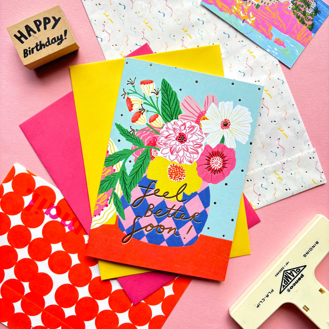 A6 Card with hand-written "Feel better soon!" text, flower vase illustration and a yellow envelope