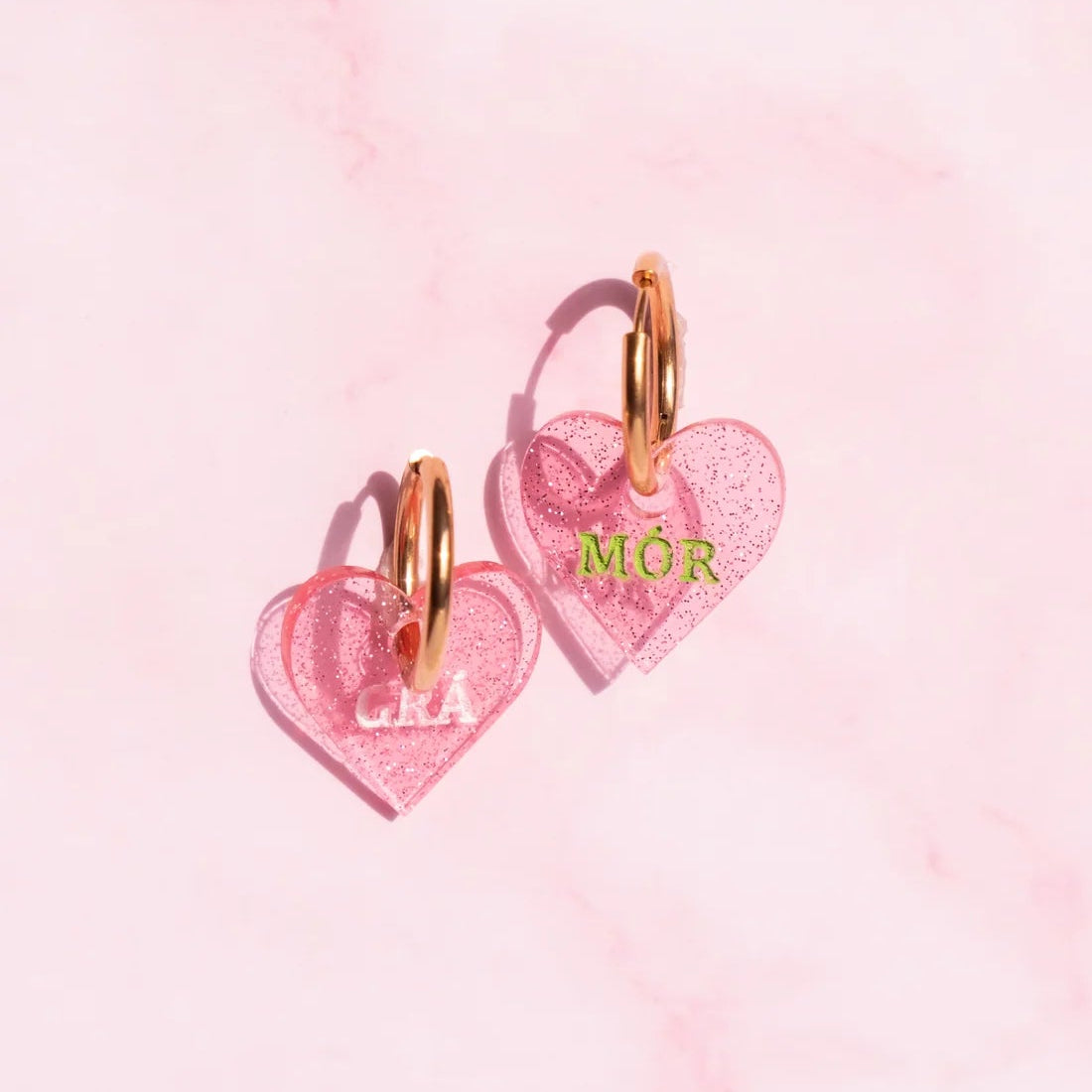 'Grá Mór' hand painted acrylic heart earrings with gold hoops.