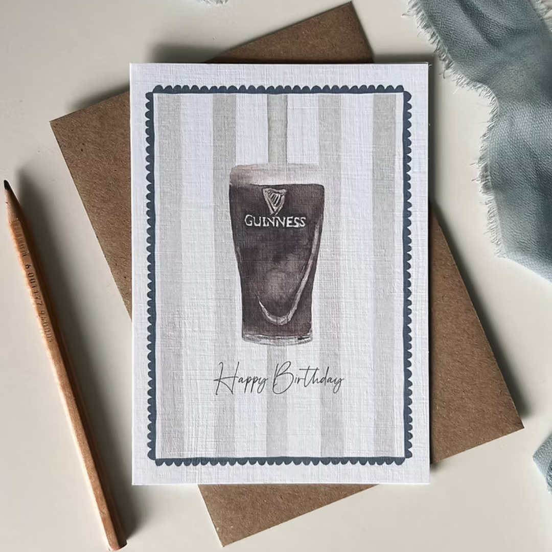 Greeting card with Guinness pint illustration and 'Happy Birthday' text.