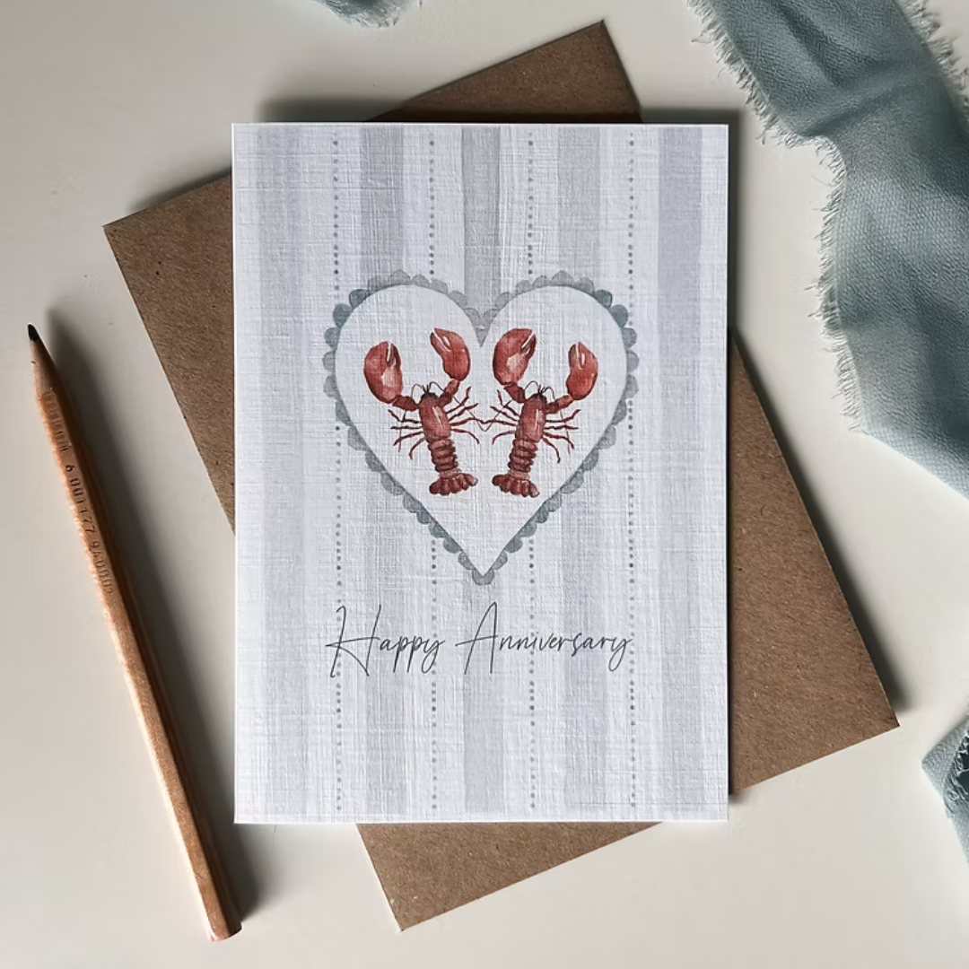 Card with illustration of two lobsters and 'Happy Anniversary' text.