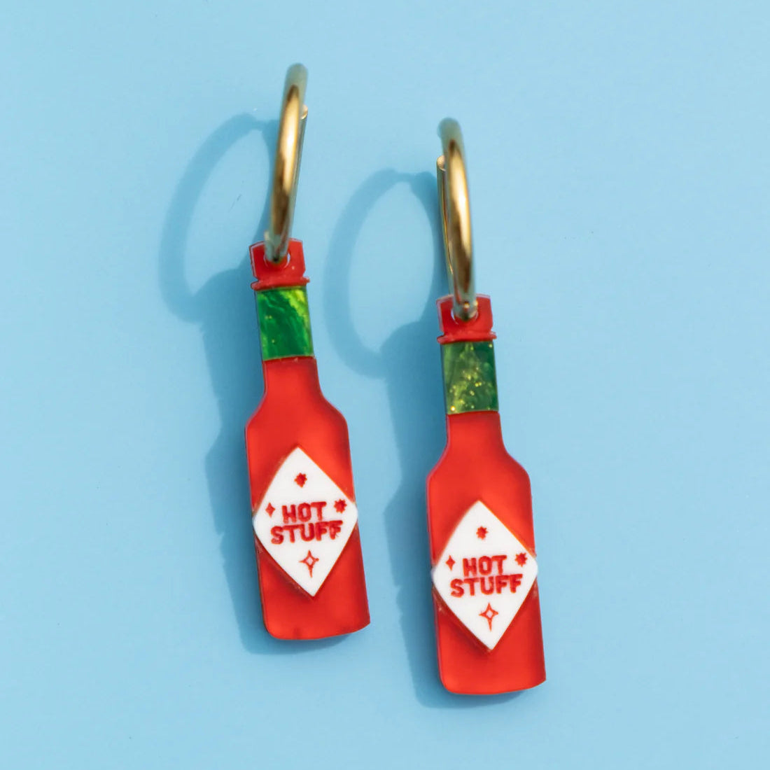 Acrylic and wood painted hot sauce pendants on gold painted stainless steel hoops