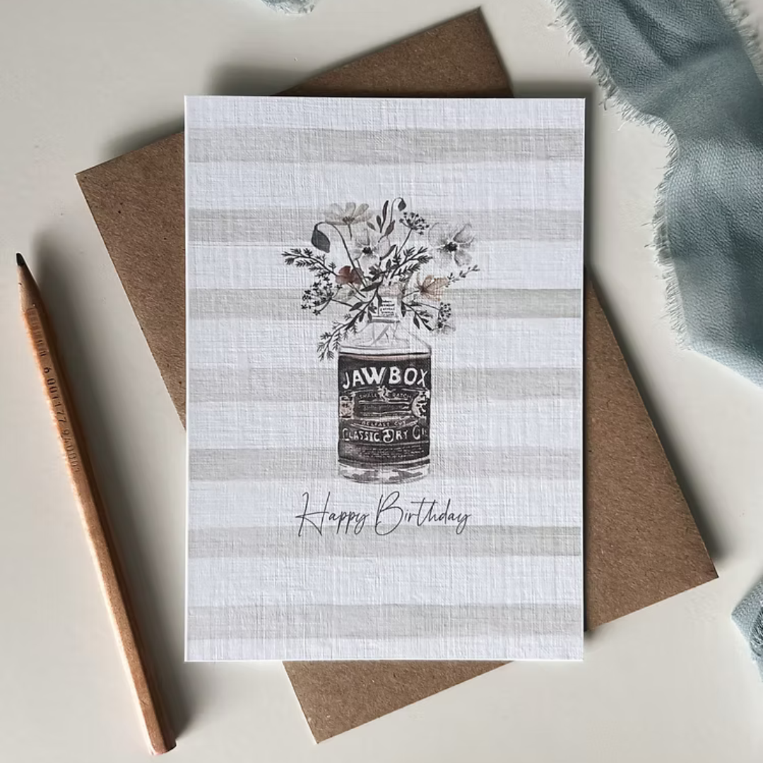 Greeting card with 'Happy Birthday' text and illustration of Jawbox gin bottle.