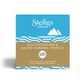 A square Skelligs Chocolate box for Milk Chocolate & Salted Caramel Truffle, featuring a blue top half with white logo and mountain graphic, a tan middle band with product name, and blue wave accents at the bottom, shown on a white background.