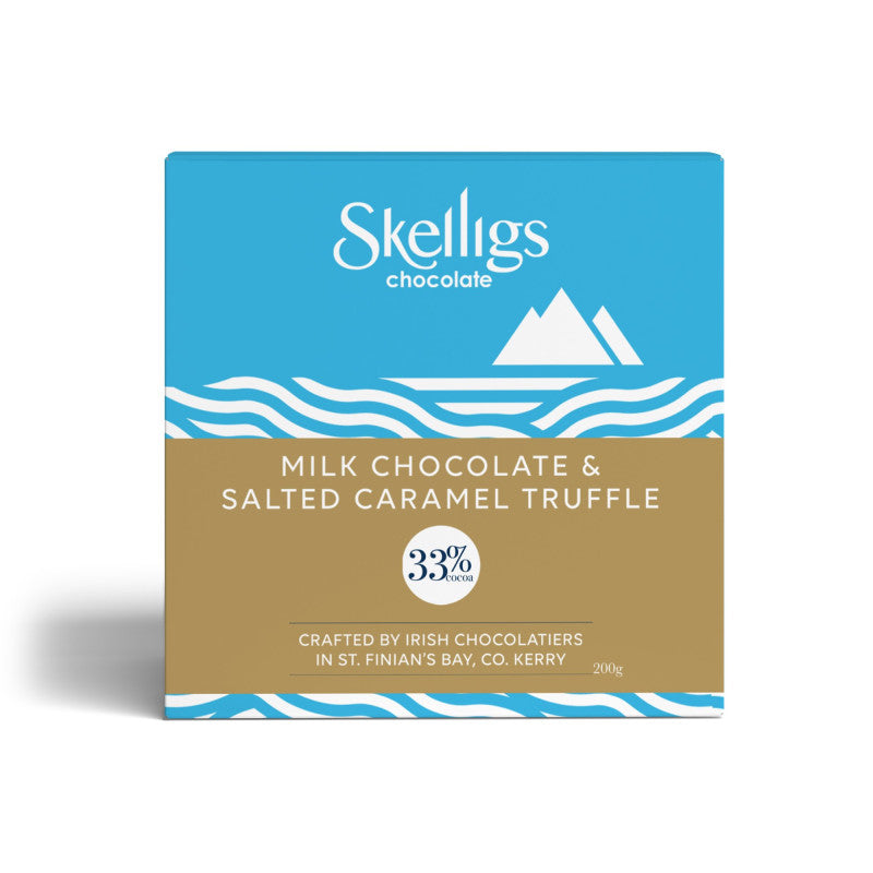 A square Skelligs Chocolate box for Milk Chocolate & Salted Caramel Truffle, featuring a blue top half with white logo and mountain graphic, a tan middle band with product name, and blue wave accents at the bottom, shown on a white background.