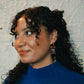 Southern & Northern crisp pendants on gold painted stainless steel hoop earrings modelled