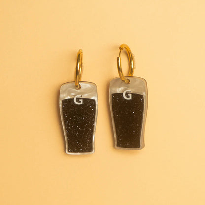  Split the G pendant on gold hoop earrings