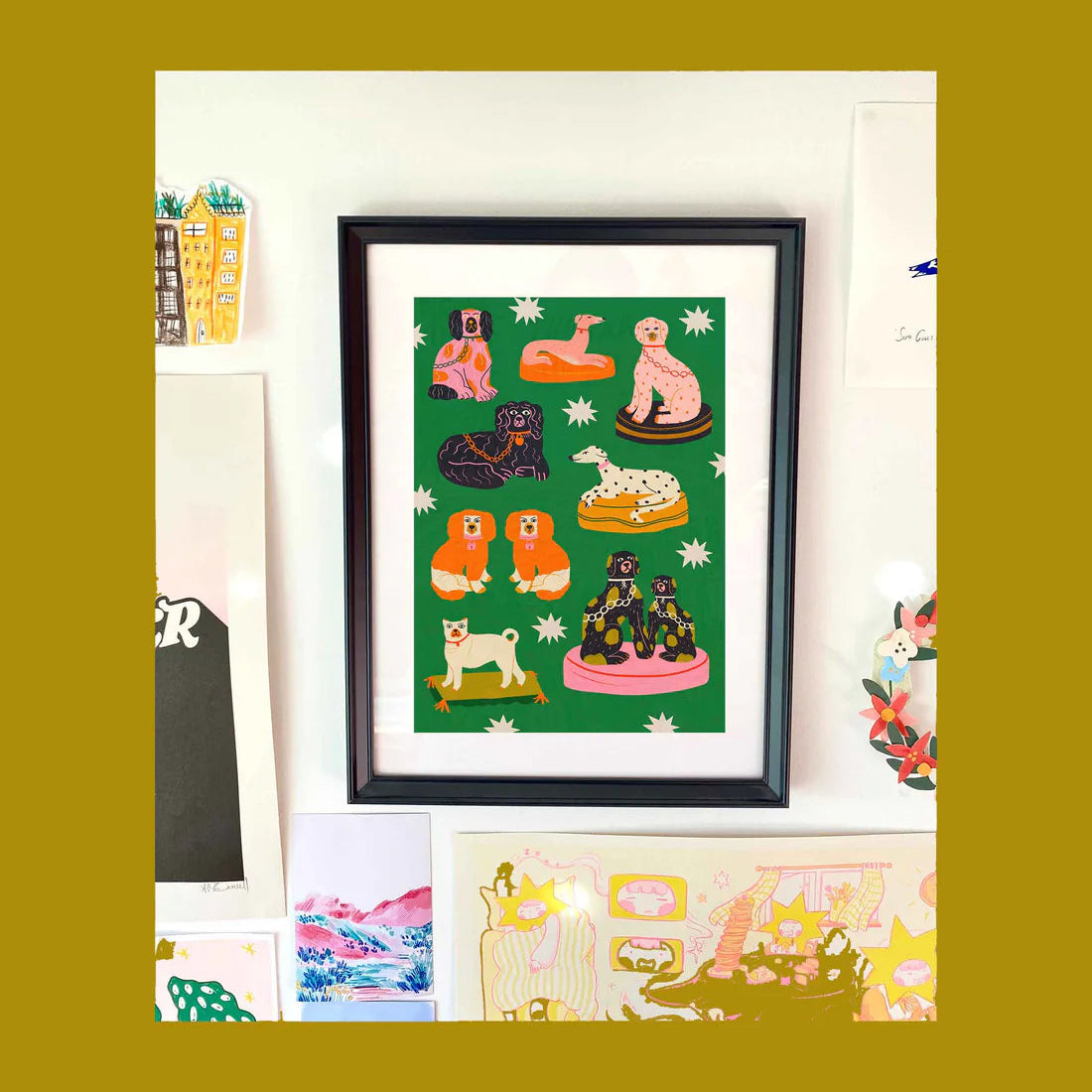 An art print featuring whimsical illustrations of various dog breeds on a green background with white star details.